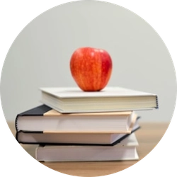 apple sitting on books